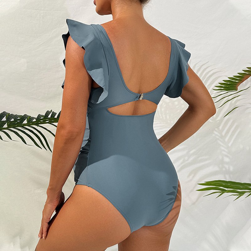 Grey maternity one-piece swimsuit featuring flutter sleeves, back cutout, and hook closure.