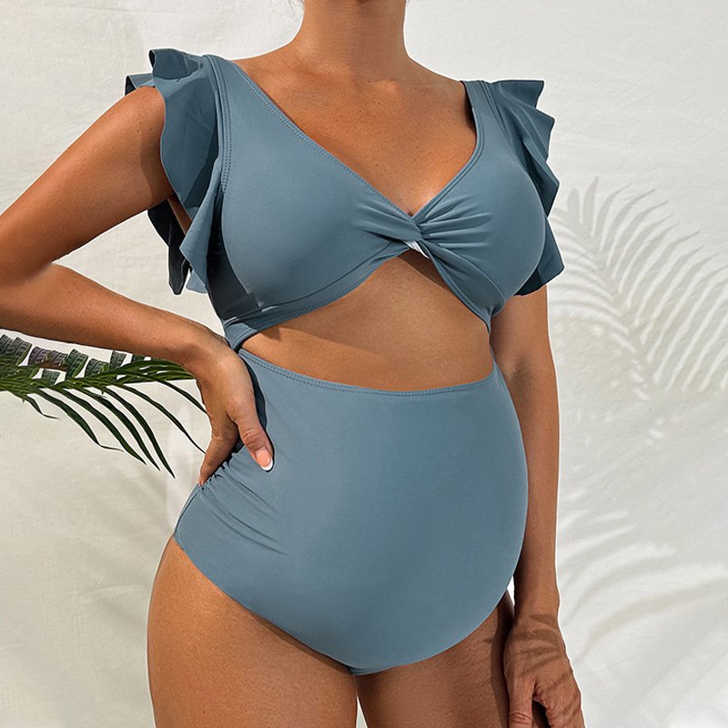 Blue maternity swimsuit with ruffled flutter sleeves, twisted V-neck, and high-waisted bottoms.