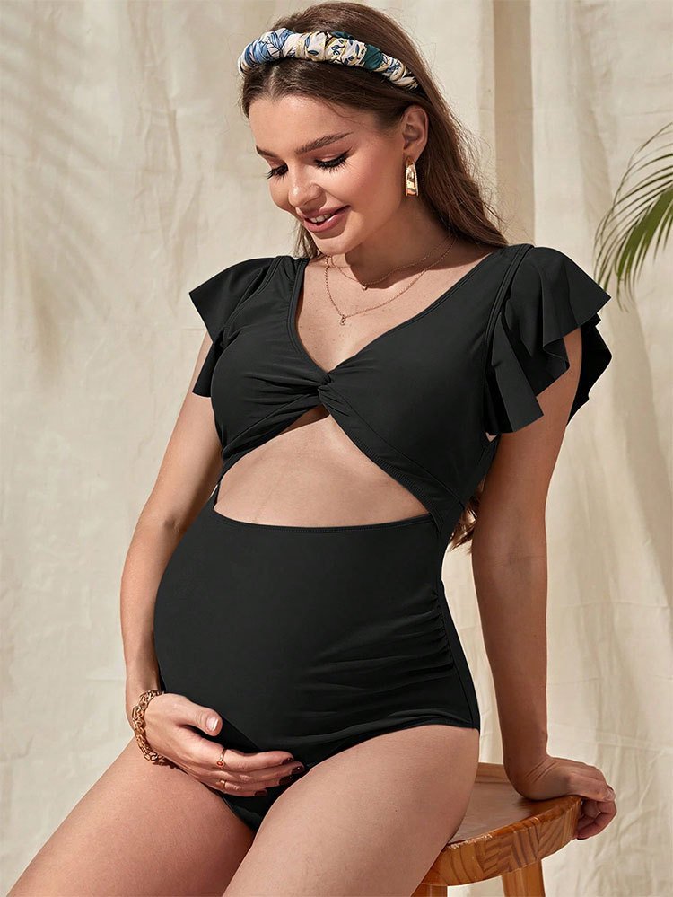 Maternity black one-piece swimsuit featuring ruffle flutter sleeves, V-neck twist front, and midriff cutout.