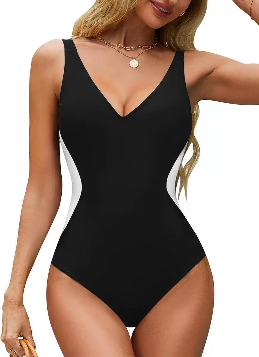 Black and white colorblock one-piece swimsuit featuring a deep V-neckline and high-cut leg design.