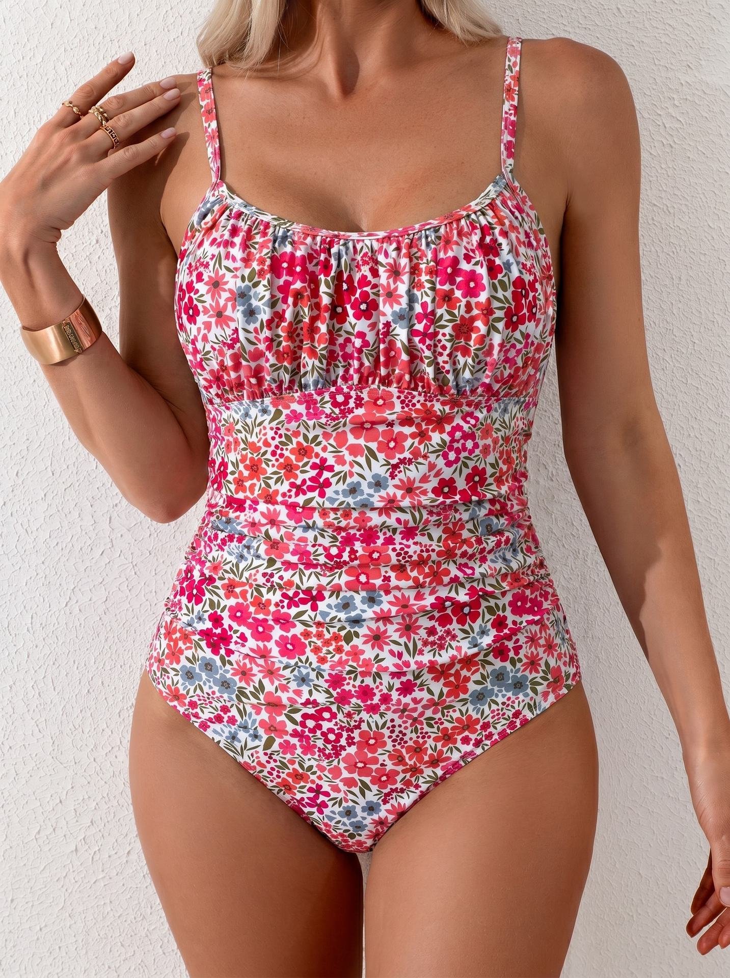 Floral print one-piece swimsuit with gathered bust, scoop neckline, and high-cut legs.