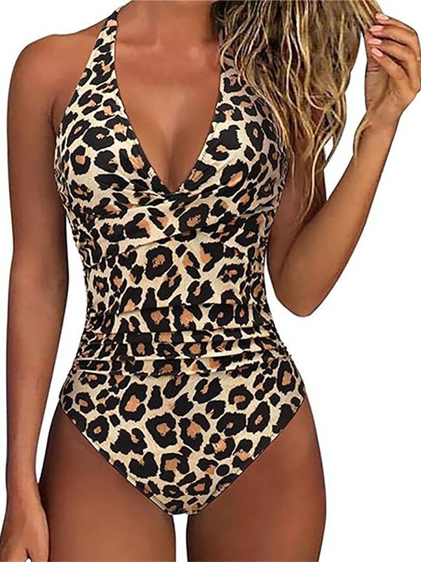 Leopard print halter one-piece swimsuit featuring a twist-front bodice and ruched waist.