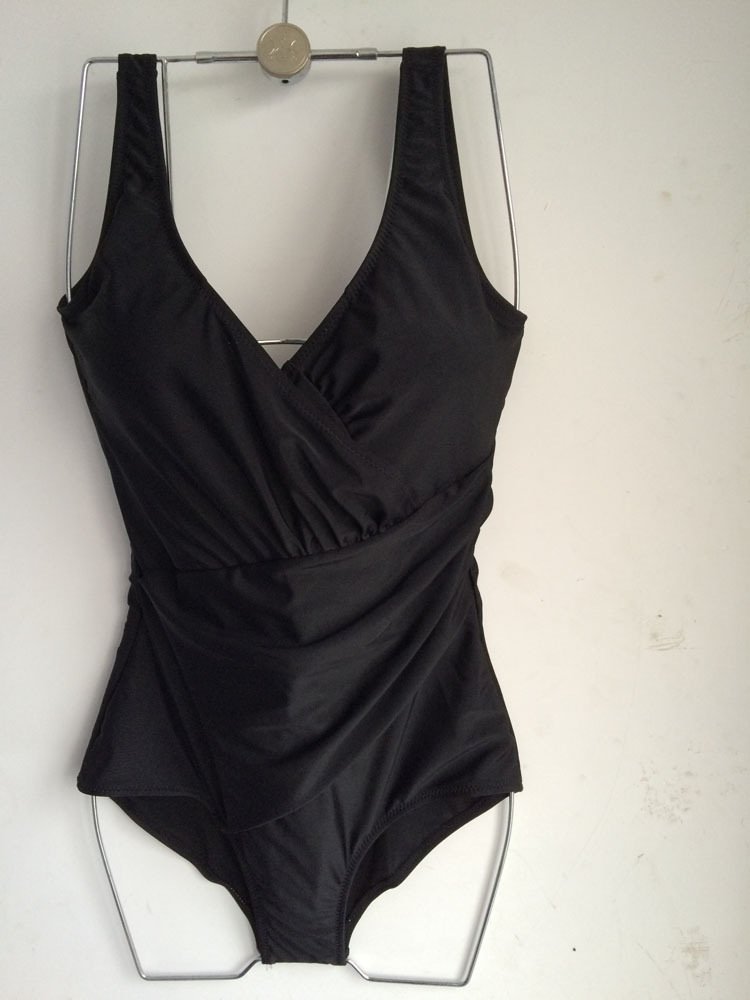 Black one-piece swimsuit featuring a deep V-neckline, wrap-front bodice, and ruched waist detailing.