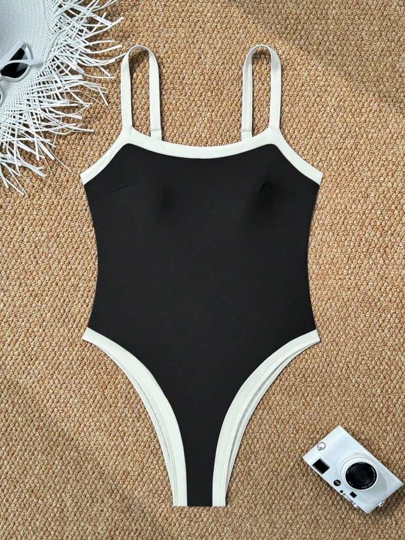 Black one-piece swimsuit with white contrast trim, square neckline, and adjustable straps.