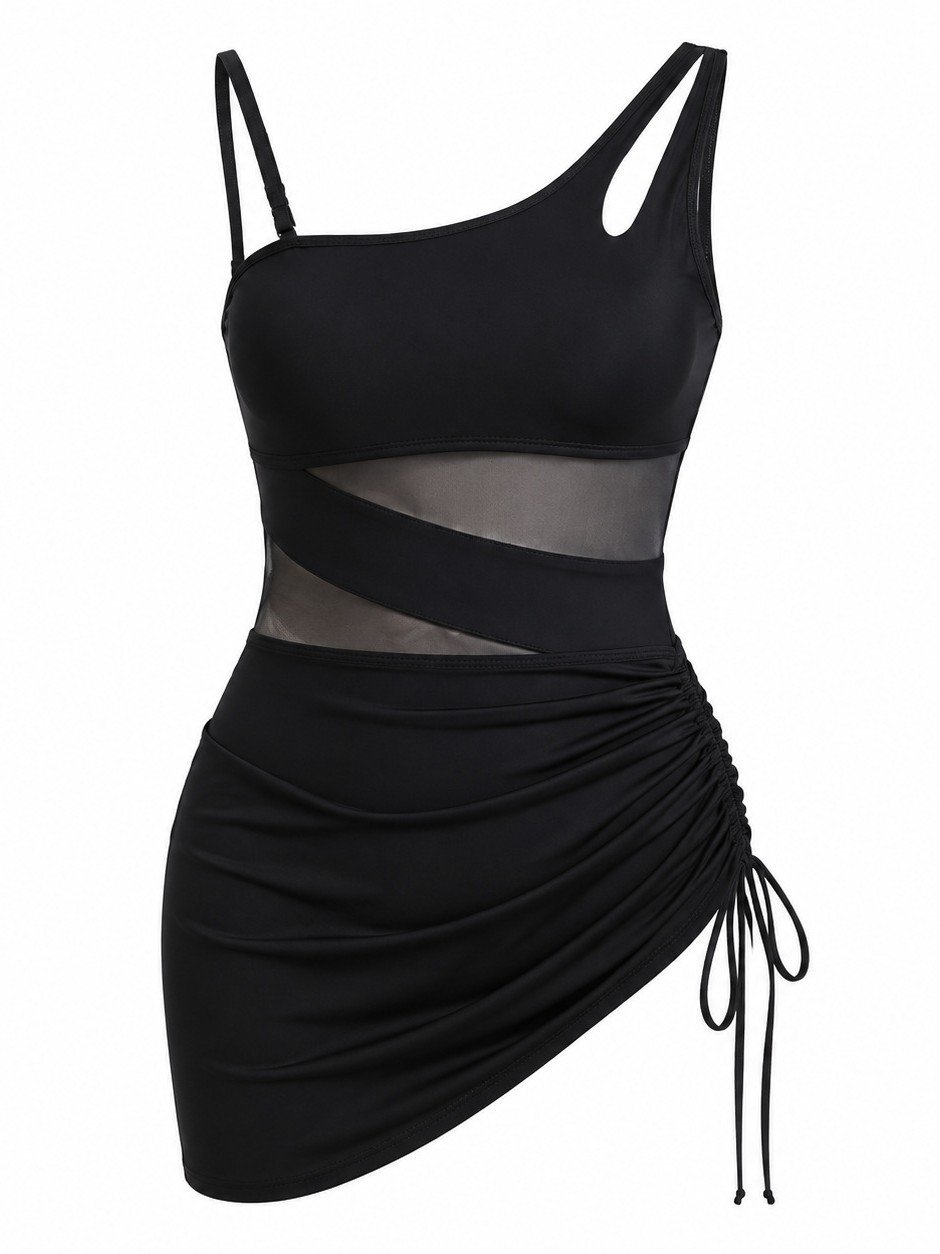 Black one-piece swim dress featuring asymmetrical straps, a sheer mesh midsection, and a ruched side-tie skirt.