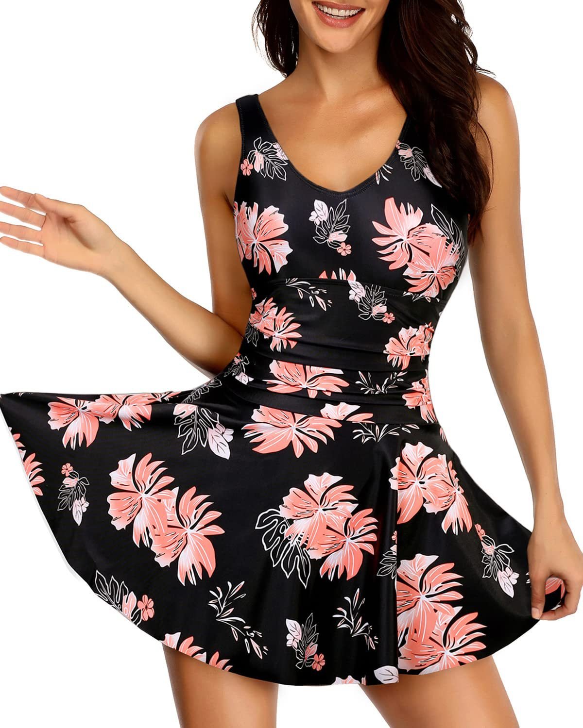Black floral print sleeveless one-piece swimsuit featuring a V-neckline and a flared skirt overlay.