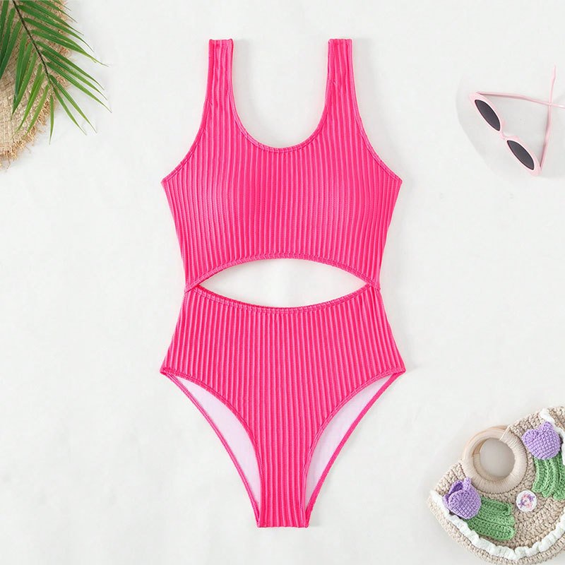 Pink ribbed tank one-piece swimsuit with a scoop neckline, wide straps, and a horizontal waist cutout.