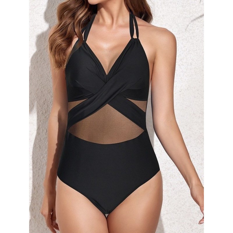 Black one-piece swimsuit with halter straps, cross-front bodice, and sheer mesh midriff panel.