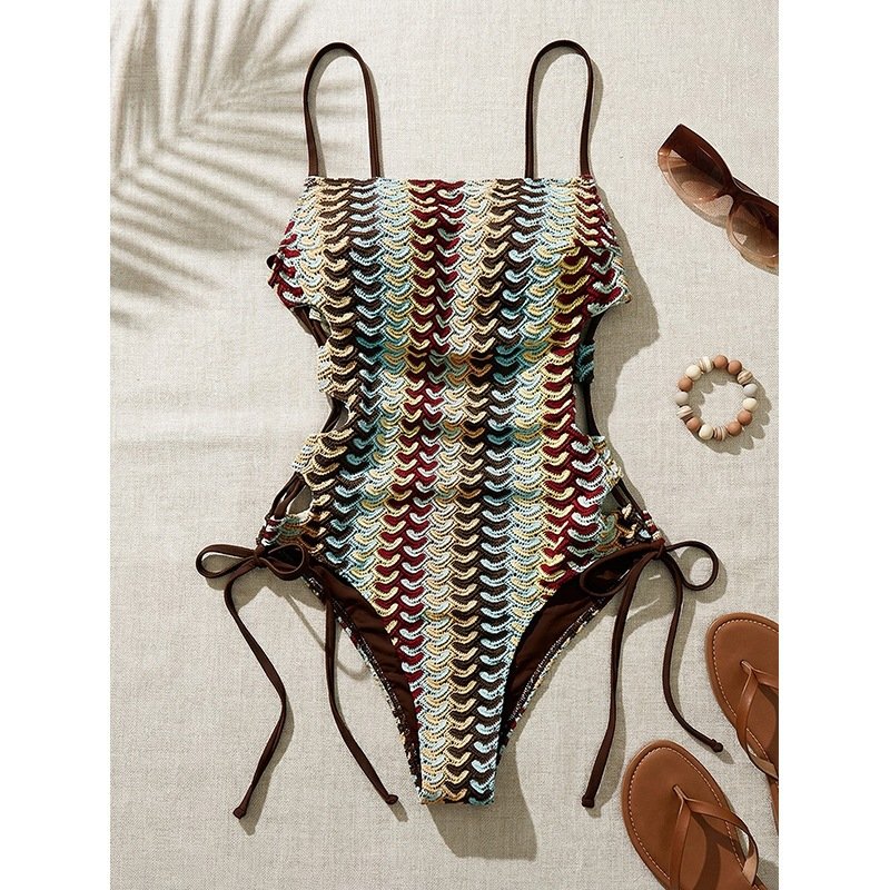 Multi-color crochet one-piece swimsuit with brown side ties and spaghetti straps.