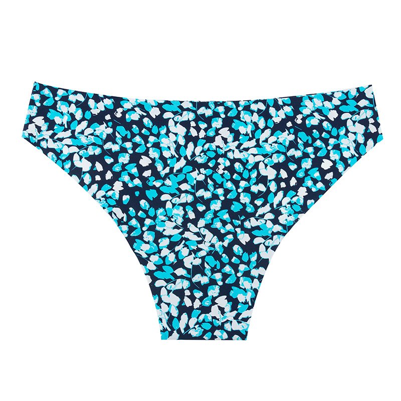 Women's navy blue mid-rise bikini bottoms featuring a scattered teal and white abstract leaf print with an elastic