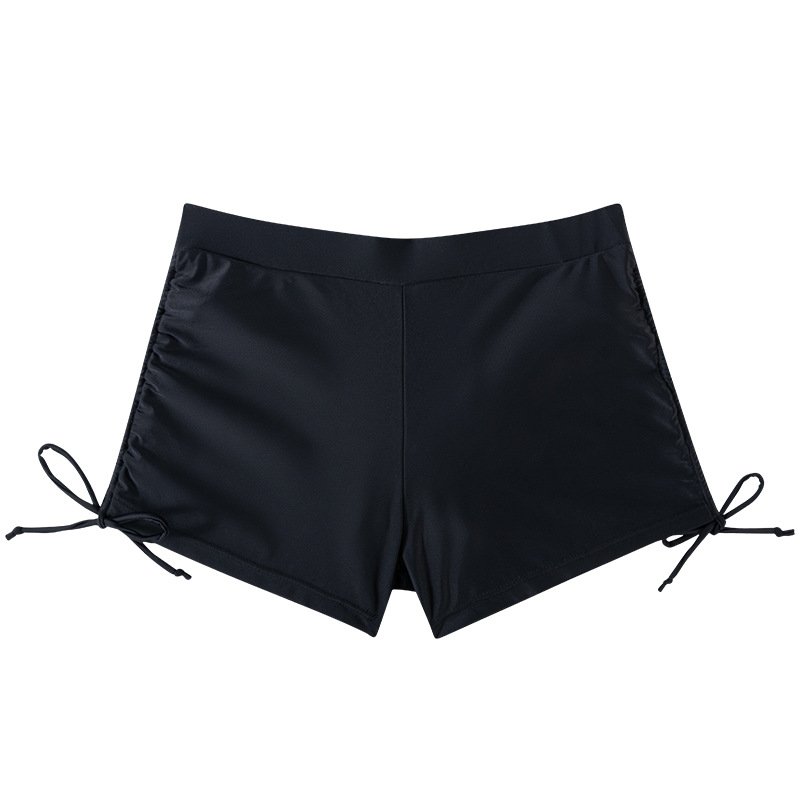 Black high-waisted swim shorts with wide elastic waistband and adjustable side-tie ruching.