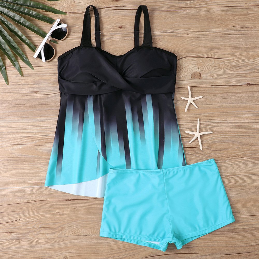 Black and teal plus-size tankini set with twist front top and boy shorts.