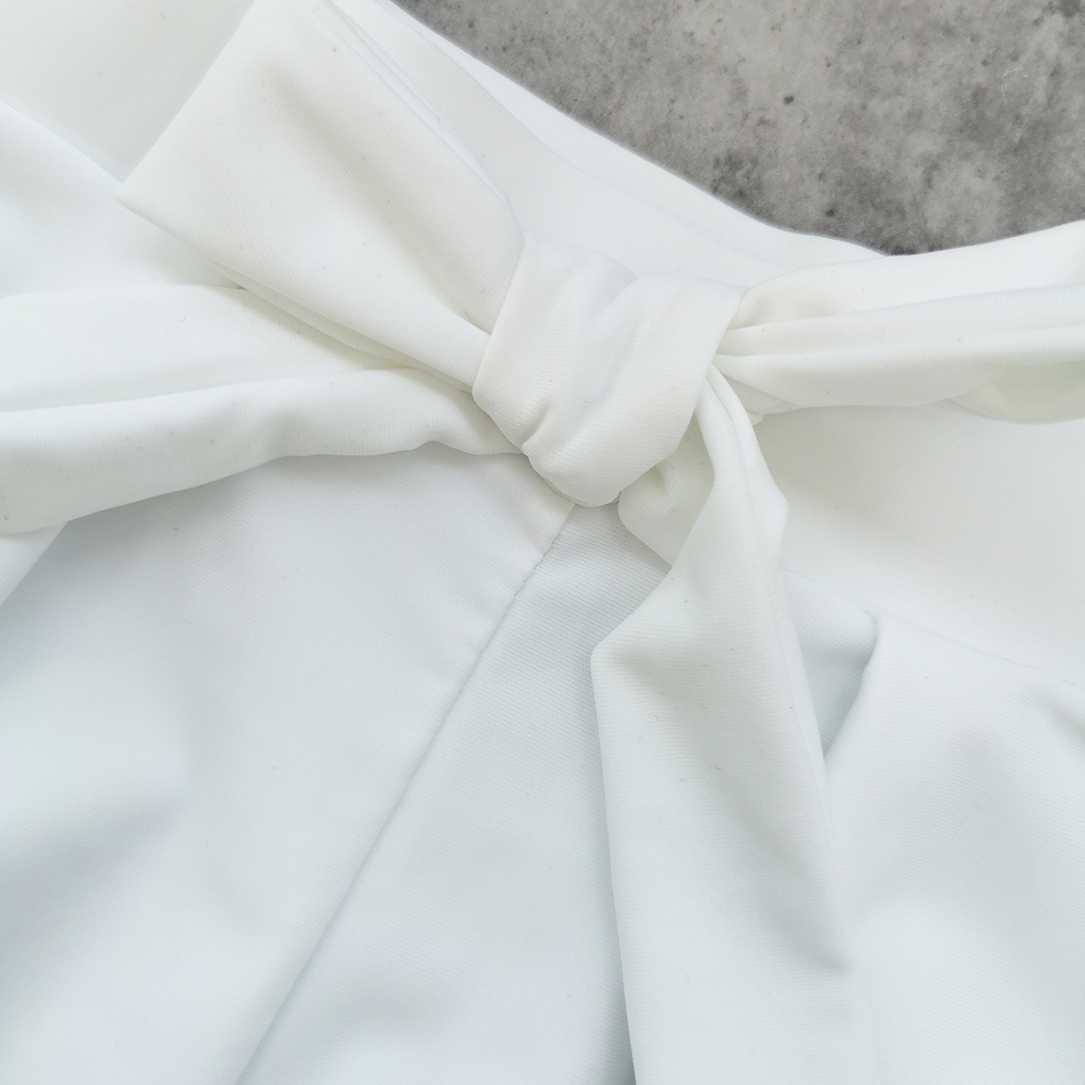 High Waist Pleated Bow Tie Shorts with Cut-Out Hem