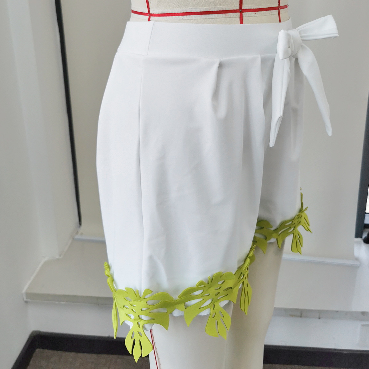 High Waist Pleated Bow Tie Shorts with Cut-Out Hem